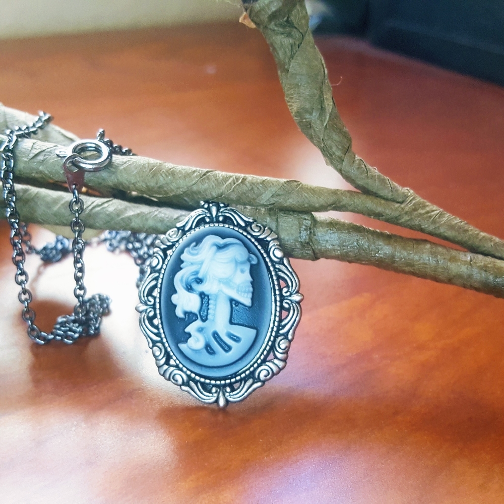 Black and white skeleton cameo necklace